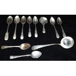 A COLLECTION OF SILVER SPOONS to include a caddy spoon, a ladle, five engraved tea spoons, various