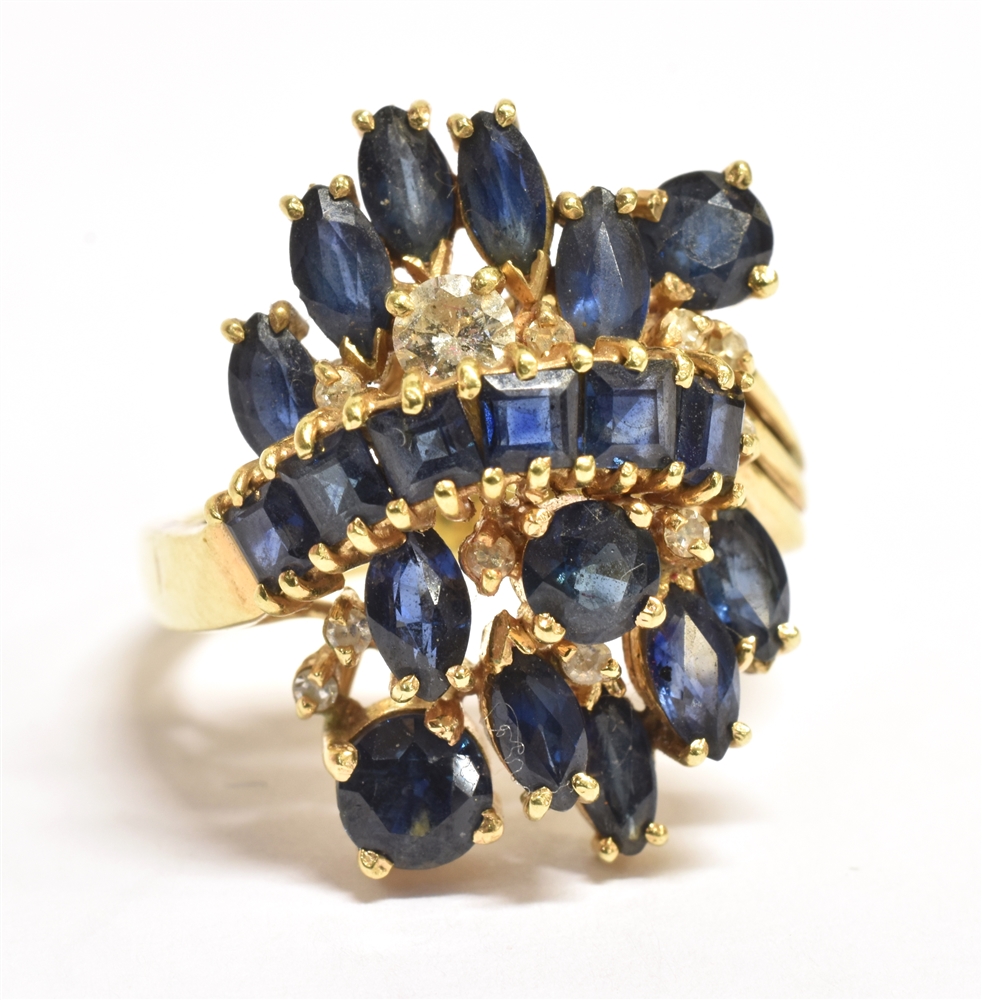 STAMPED 18K SAPPHIRE CLUSTER RING The large cluster (to include one small diamond) measuring 2.5 x