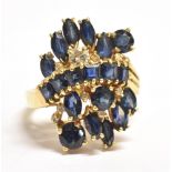 STAMPED 18K SAPPHIRE CLUSTER RING The large cluster (to include one small diamond) measuring 2.5 x