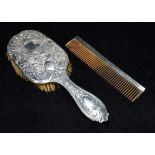 EDWARDIAN SILVER BRUSH & BAKELITE COMB A silver backed hairbrush depicting a bucolic scene in