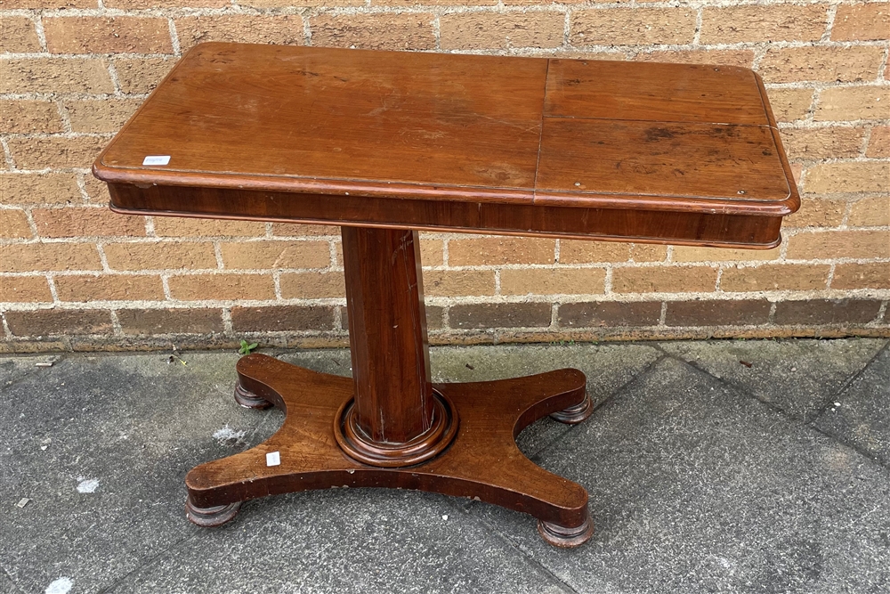 A VICTORIAN MAHOGANY TABLE the rectangular top with double adjustable reading stand, on octagonal