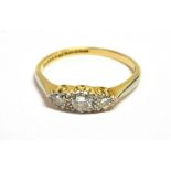 ESTATE DIAMOND THREE STONE RING Central diamond approx 0.23 carats, flanked by two 0.07 carats