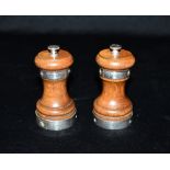 SILVER BANDED PEPPER & SALT GRINDERS An elegant pair of oak bodied condiment grinders, accentuated