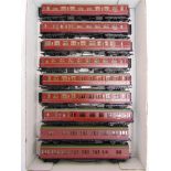 [OO GAUGE]. NINE ASSORTED B.R. COACHES by Mainline (7), and Airfix (2), all in maroon livery, all