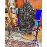 A VERY LARGE WROUGHT IRON FIRE BASKET AND ANDIRONS with cast iron fireback, 107cm wide, 117cm high