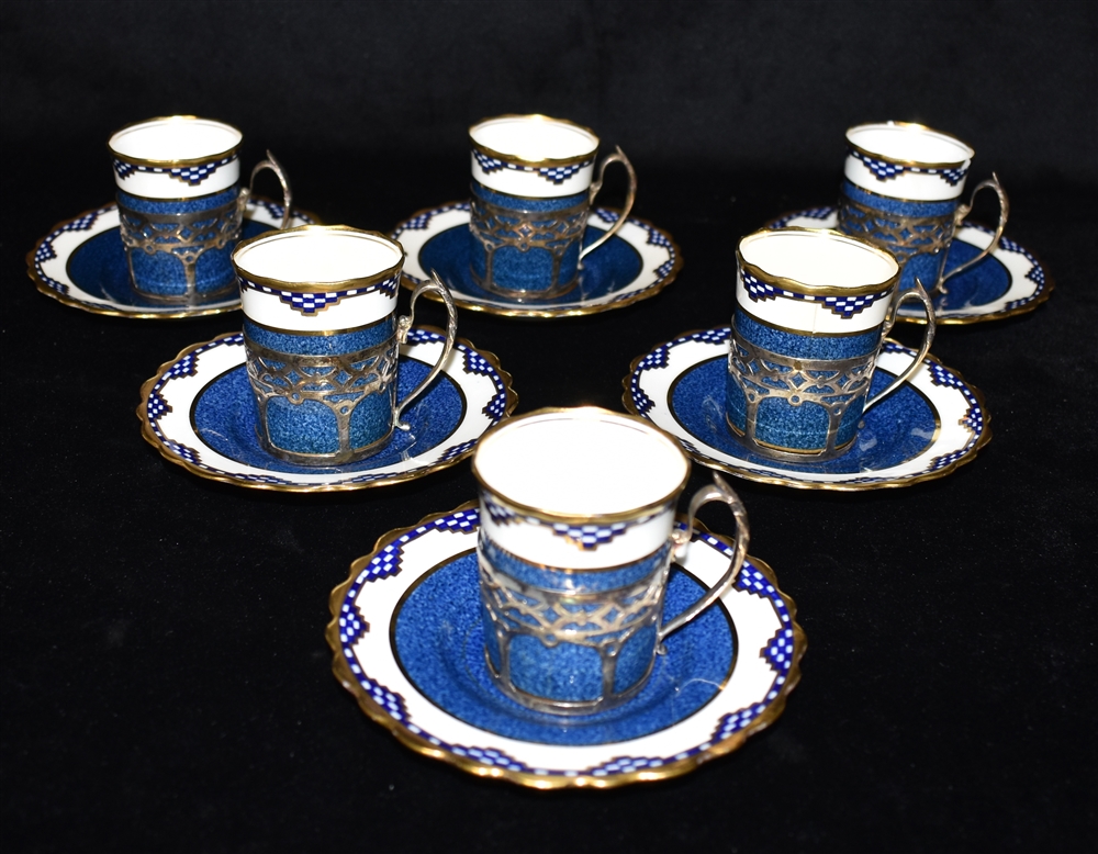 A SET OF SIX SILVER MOUNTED AYNSLEY COFFEE CANS AND SAUCERS the silver hallmarked Sheffield 1930