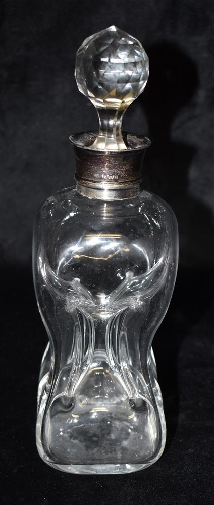 EDWARDIAN SILVER TOPPED DECANTER Stands approx 25cm high, with a faceted orb stopper and slightly