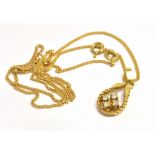 MODERN DIAMOND & GOLD PENDANT A 9ct gold tear drop shaped pendant, set with four single cut good