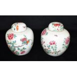 A PAIR OF CHINESE PORCELAIN GINGER JARS AND COVERS with polchrome enamelled floral decoration,