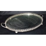 AN EPNS MOUNTED OVAL TRAY with pierced gallery, 67cm wide including handles