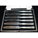 BOXED SET OF SILVER TEA KNIVES A set of six tea knives in black velvet lined presentation case.