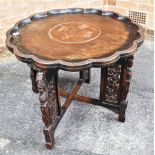 AN ORIENTAL BENARES STYLE CIRCULAR TRAY TOP OCCASIONAL TABLE on folding stand, diameter 70cms
