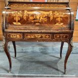 A CONTINENTAL GILT METAL MOUNTED CYLINDER TOP BUREAU with Dutch marquetry decoration, the cylinder