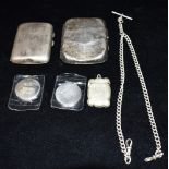 SILVER CIGARETTE HOLDERS AND 1OZ ROUNDS One chased and engraved holder, hall marked Birmingham