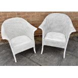 A MATCHED PAIR OF LLOYD LOOM ARMCHAIRS Condition Report : generally good, one still retaining