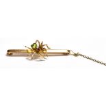 ANTIQUE PERIDOT SPIDER BAR BROOCH 9ct gold, 4.8cm long x 2.4mm wide flat bar decorated with a