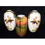 A PAIR OF ROYAL DOULTON VASES OF OVOID FORM each decorated with pair of flamingoes and sprays of