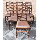 A SET OF SIX OAK LADDERBACK DINING CHAIRS with drop-in seats, on block turned supports Condition