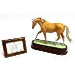 A LIMITED EDITION ROYAL WORCESTER MODEL 'PALOMINO' BY DORIS LINDNER numbered 360/750, on wooden