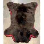 A BLACK BEAR SKIN RUG length 134cm, width 86cm, from Vancouver, Canada 1967