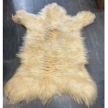 A MOUNTAIN GOAT SKIN RUG length 120cm, width 95cm, from Vancouver, Canada, 1967