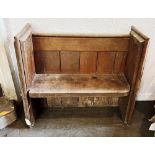 A SMALL OAK PEW 101cm wide 40cm deep 88cm high Condition Report : signs of age, old worm and old rot