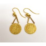 A PAIR OF QUARTER GUINEA EARRINGS Quarter quinea coins on high carat gold shepherd crook earwires,