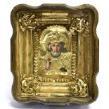 19TH CENTURY RUSSIAN SCHOOL: icon of St Nicholas, oil on board with ornate gilt foil oklad, within