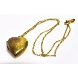VINTAGE 9CT GOLD ENGRAVED LOCKET & CHAIN A foliate engraved locket on a 9 ct chain with a chenier