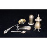 SILVER ITEMS TO INCLUDE SIFTER SPOON Two silver pepper pots one on pad feet, a salt spoon, claw foot