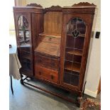 AN OAK SIDE-BY-SIDE BUREAU BOOKCASE the central bureau section above two drawers, flanked by