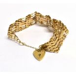 9CT GOLD SIX BAR GATE BRACELET 18cm long, 2cm wide, consisting of six alternating flat and twisted