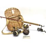 A 5'2' CARBON FIBRE ROD with a 'Kenley 5010 Spinning' reel attached and a small wicker creel