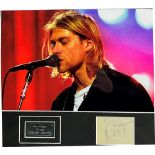 POP MEMORABILIA - KURT COBAIN (1967-1994), NIRVANA A clipped autograph book page, signed in