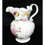 A LARGE COALPORT WATER JUG with relief moulded and polychrome enamelled floral decoration, 27cm high