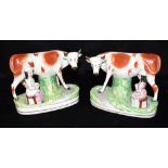 A PAIR OF STAFFORDSHIRE COW AND MILKMAID GROUPS 15cm high Condition Report : both in good