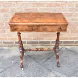 A VICTORIAN WALNUT SIDE TABLE fitted with two short drawers, the two turned supports raised on