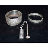 SILVER CUFF BANGLES AND INGOT PENDANT 3.1cm wide scroll and foliate engraved hinged cuff bangle,
