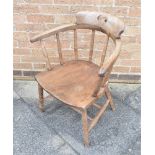 A SMOKERS BOW ARMCHAIR with elm seat, on turned supports with double H-shape stretcher, 44cm wide