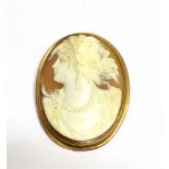 VICTORIAN SHELL CAMEO BROOCH Finely carved shell cameo depicting a classical woman with dextral