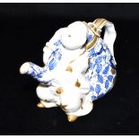 A VICTORIAN AESTHETIC TEAPOT BY BROWNFIELD modelled as a Chinaman holding a sack , impressed diamond