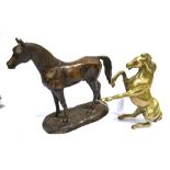 A HEAVY BRASS FIGURE OF A REARING HORSE Height 21cm and another of a resin standing horse, height