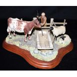 A BORDER FINE ARTS GROUP 'JAMES HERRIOT STUDIO FIGURINES, BREAKING THE ICE, A2682' A farmer breaking