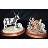 A BORDER FINE ARTS GROUP 'PAIR OF JACOB SHEEP (FOUR HORNED) B0352' Height 20cm, width 23cm and