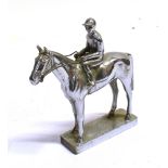 A PLATED CAR MASCOT Of a racehorse and jockey, height 11.5cm, length 11cm