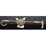 A BRASS MOUNTED CAST HUNTING WHIP ORNAMENT with brass fox mask surmount for wall hanging, length