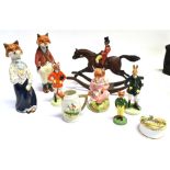 FIVE ASSORTED FIGURES OF FOXES IN HUNT DRESS AND COSTUME a similar figure of a hare; a rocking horse