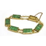 ANTIQUE JADEITE JADE & GOLD BRACELET 16cm long, comprising five carved jadeite jade rectangular