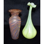 SHAKSPEAR GLASS: a green Art glass vase with elongated neck and flared frilled rim, trailed