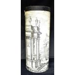 AN UMRELLA STAND IN THE MANNER OF PIERO FORNASETTI of cylidrical form, typically decorated with